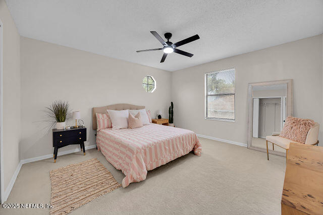 2191 Birch Bark Drive Jacksonville, FL 32246 - Photo 36 of 49 a bedroom with a bed and window