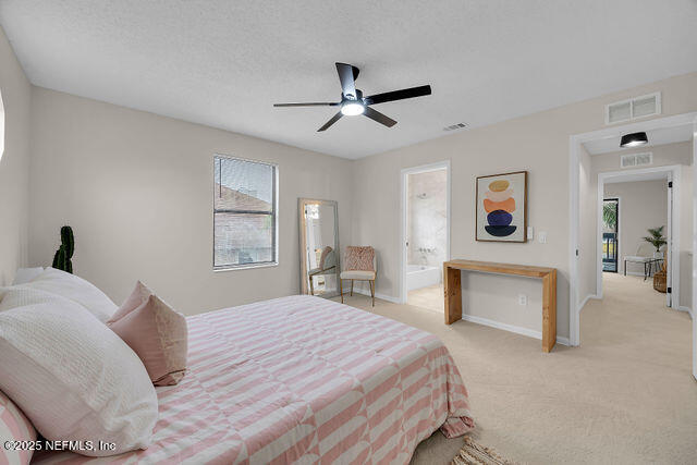 2191 Birch Bark Drive Jacksonville, FL 32246 - Photo 37 of 49 a bedroom with a large bed and a chandelier