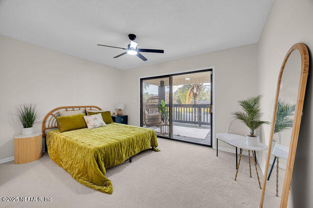 2191 Birch Bark Drive Jacksonville, FL 32246 - Photo 41 of 49 a bedroom with a bed and a large window