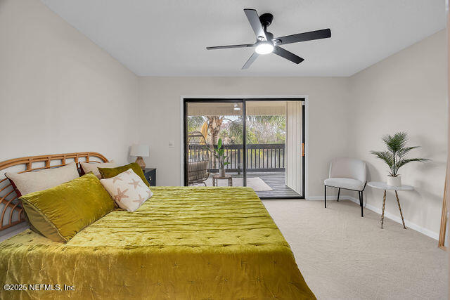 2191 Birch Bark Drive Jacksonville, FL 32246 - Photo 43 of 49 a spacious bedroom with a bed and a chandelier