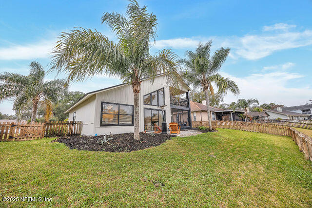 2191 Birch Bark Drive Jacksonville, FL 32246 - Photo 46 of 49 a view of a house with a big yard and palm trees