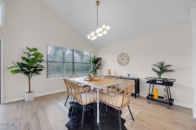 2191 Birch Bark Drive Jacksonville, FL 32246 - Photo 7 of 49 a view of a dining room with furniture and wooden floor