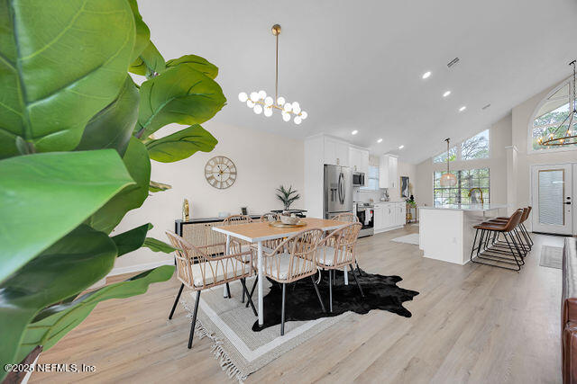 2191 Birch Bark Drive Jacksonville, FL 32246 - Photo 8 of 49 a view of a dining room with furniture and wooden floor