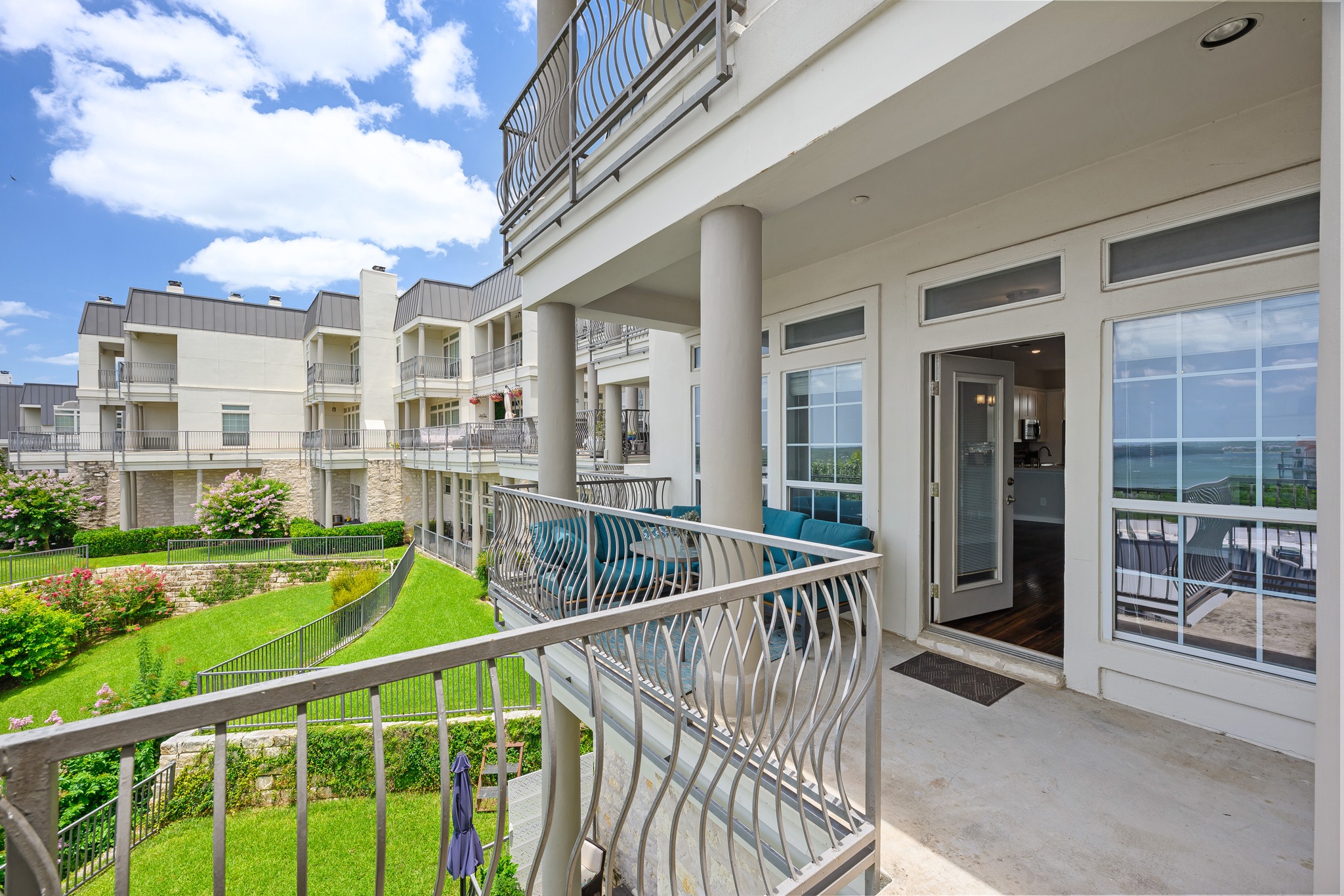 2918 Ranch Road 620 North, Unit S242 Austin, TX 78734 - Photo 18 of 35 A tiered outdoor space with multiple balconies offers serene green views and glimpses of the water.