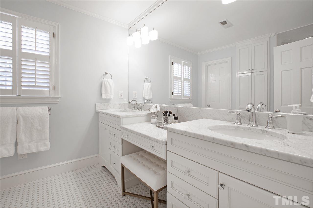 2000 Lewis Circle Raleigh, NC 27608 - Photo 17 of 30 a bathroom with double sink and a mirror