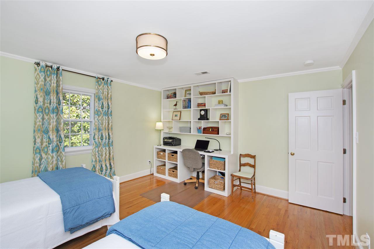 2000 Lewis Circle Raleigh, NC 27608 - Photo 21 of 30 a living room with furniture and a wooden floor