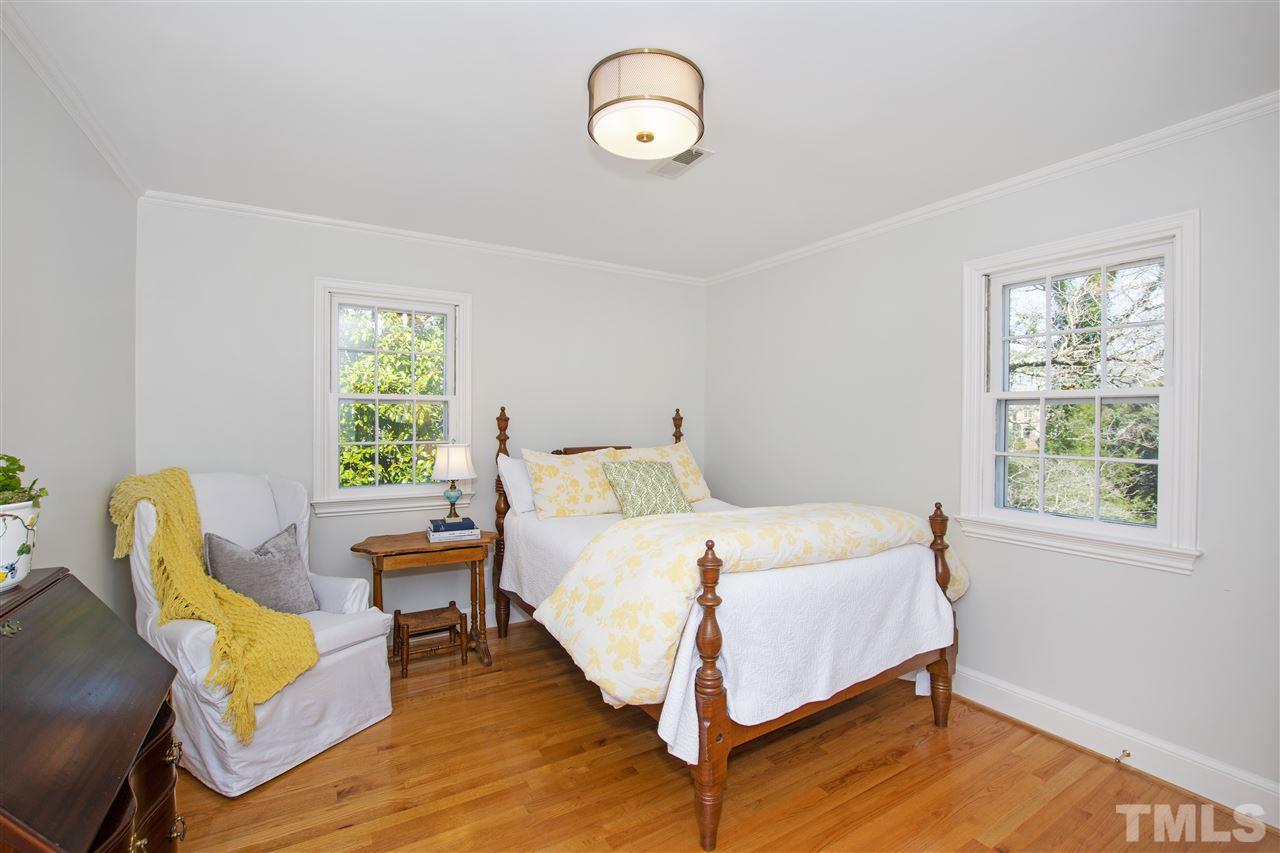 2000 Lewis Circle Raleigh, NC 27608 - Photo 22 of 30 a bedroom with a bed and a window