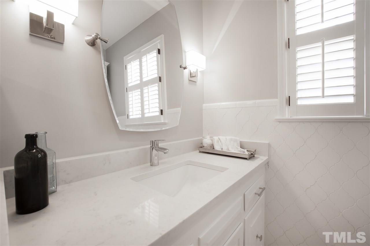 2000 Lewis Circle Raleigh, NC 27608 - Photo 23 of 30 a bathroom with a sink and a window