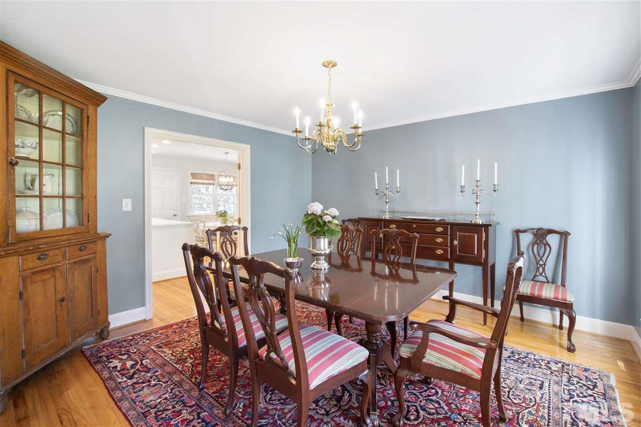 2000 Lewis Circle Raleigh, NC 27608 - Photo 6 of 30 a view of a dining room with furniture and chandelier