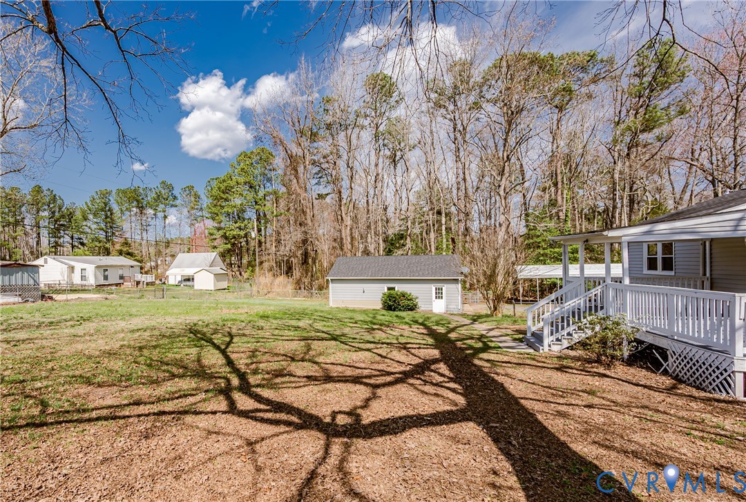 15412 Exter Mill Road Chesterfield, VA 23838 - Photo 17 of 60 View of grassy yard featuring an outdoor structure