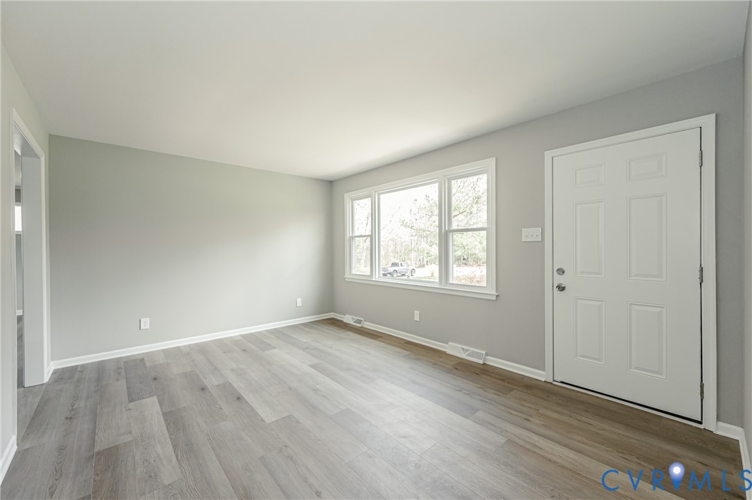 15412 Exter Mill Road Chesterfield, VA 23838 - Photo 24 of 60 Entryway with light wood-style flooring and basebo