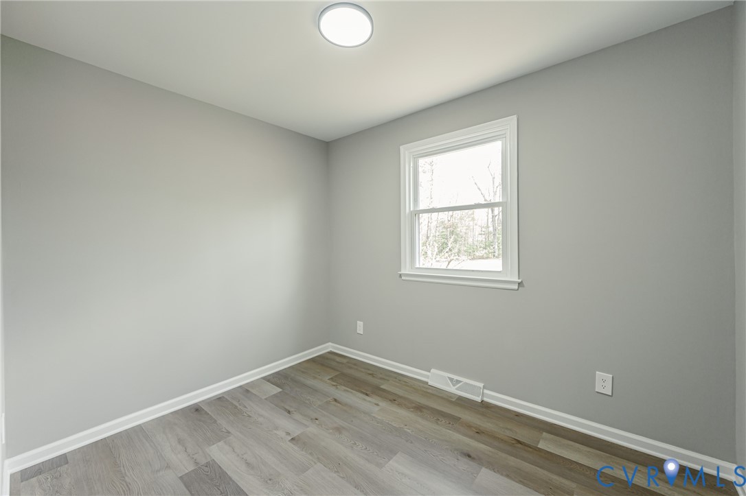 15412 Exter Mill Road Chesterfield, VA 23838 - Photo 39 of 60 Spare room with light wood-type flooring and baseb