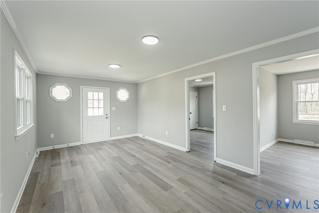15412 Exter Mill Road Chesterfield, VA 23838 - Photo 57 of 60 Foyer featuring crown molding and light wood-type