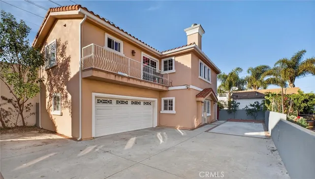 a front view of a house with a garage