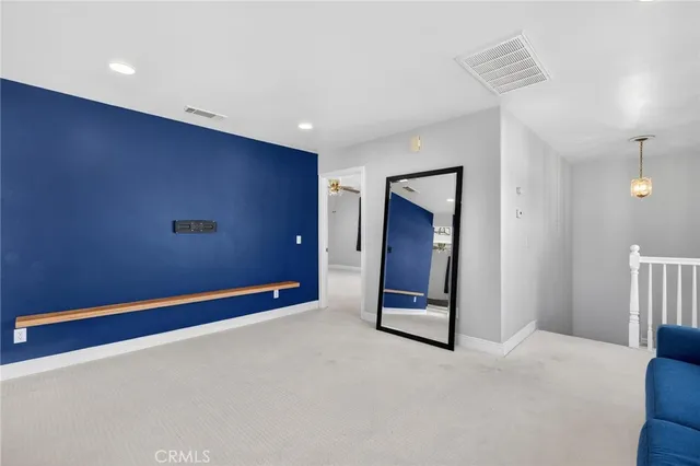 a view of a hallway to rooms and a kitchen