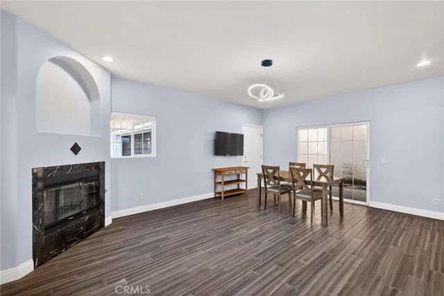 a view of a livingroom with furniture and a flat screen tv