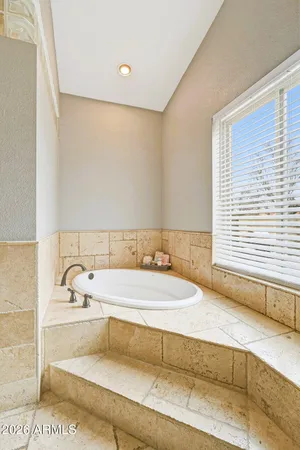 a bathroom with a bathtub and a sink