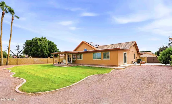 a view of a house with a yard and garage
