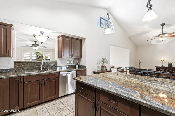 a kitchen with a sink and stove