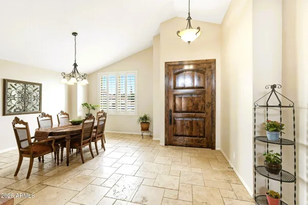 a dining room with furniture and window