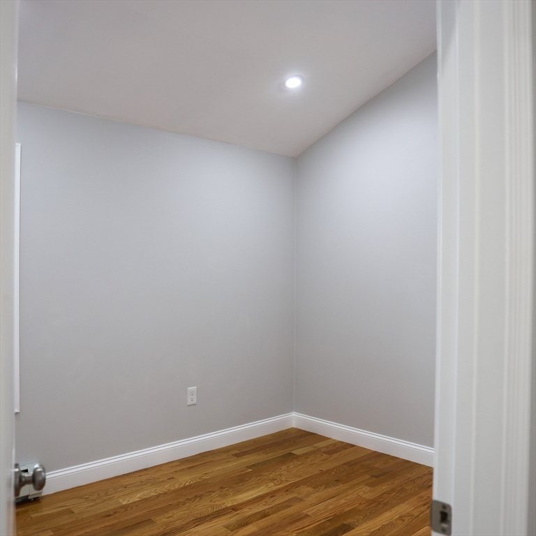 598 School Street, Unit REAR ADU Lowell, MA 01851 - Photo 31 of 42 a view of a room with wooden floor
