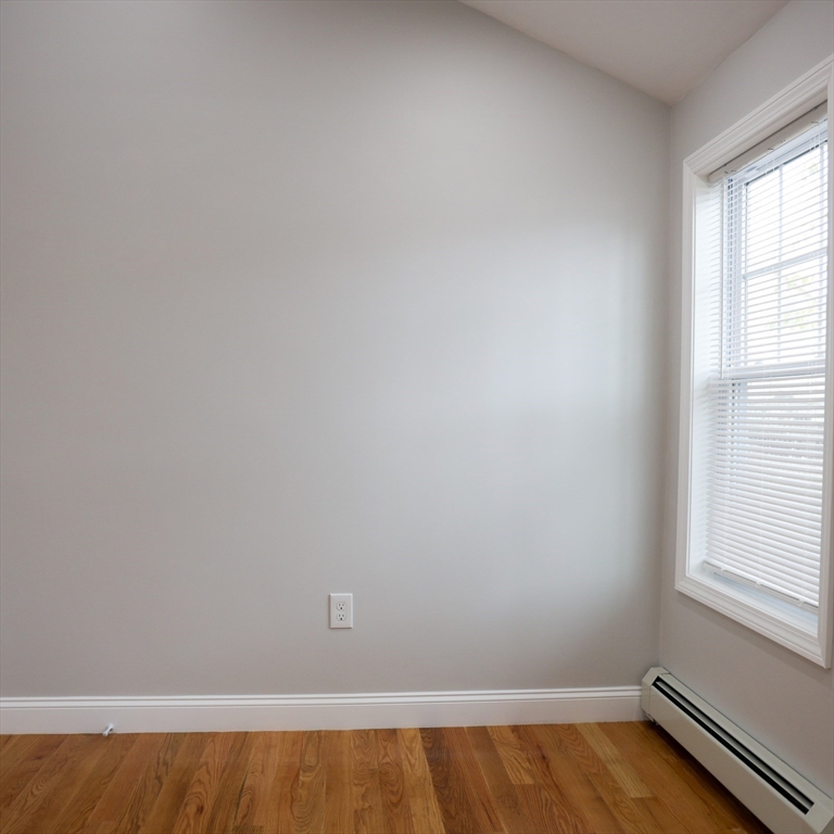 598 School Street, Unit REAR ADU Lowell, MA 01851 - Photo 35 of 42 a view of a small space with window