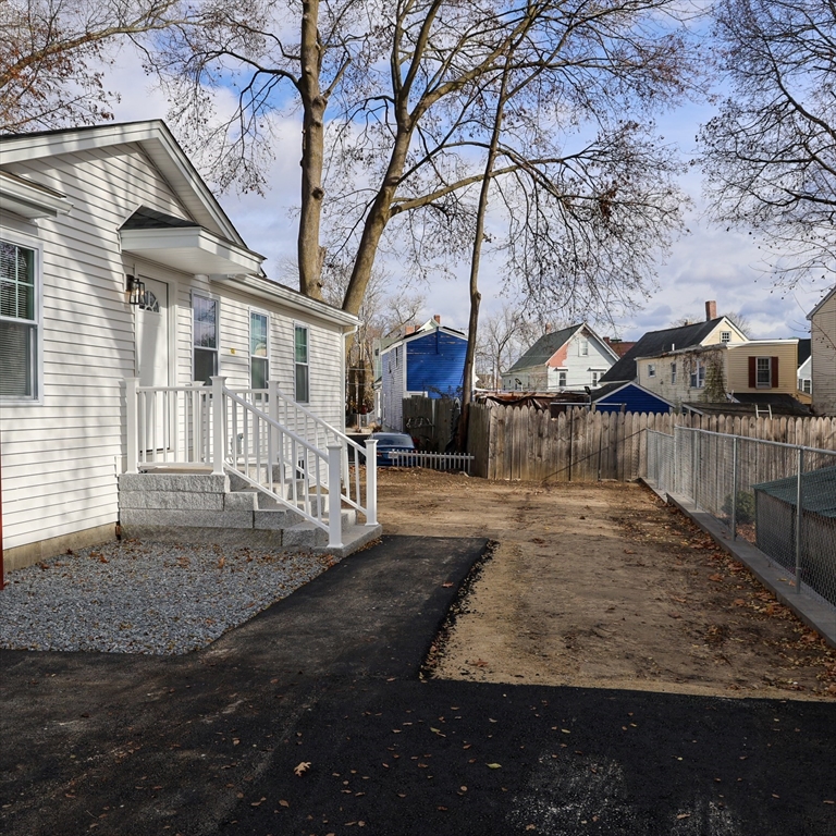 598 School Street, Unit REAR ADU Lowell, MA 01851 - Photo 7 of 42 a view of a yard in front of house
