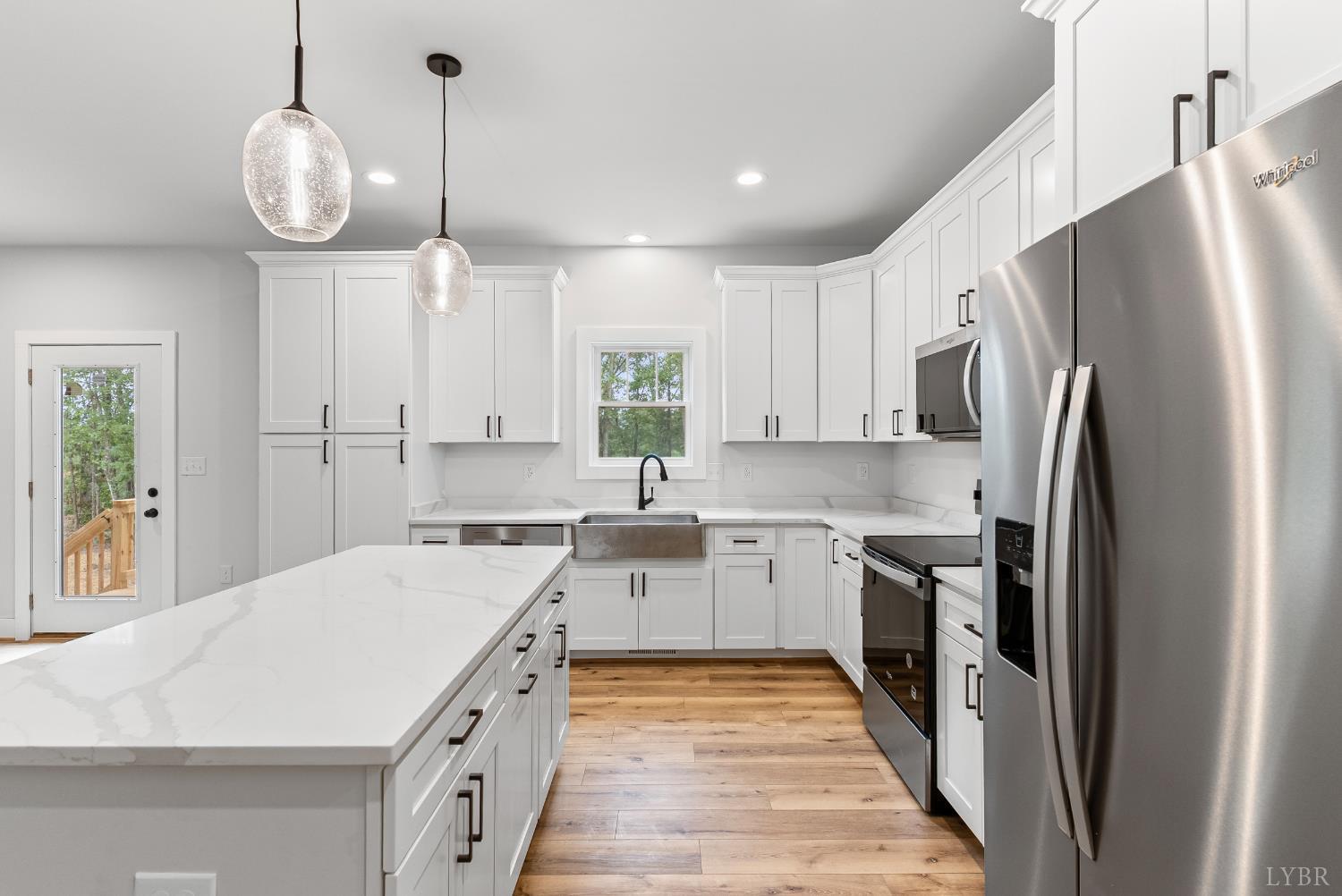 594 Community Road Dillwyn, VA 23936 - Photo 21 of 49 a kitchen with a sink stainless steel appliances and cabinets
