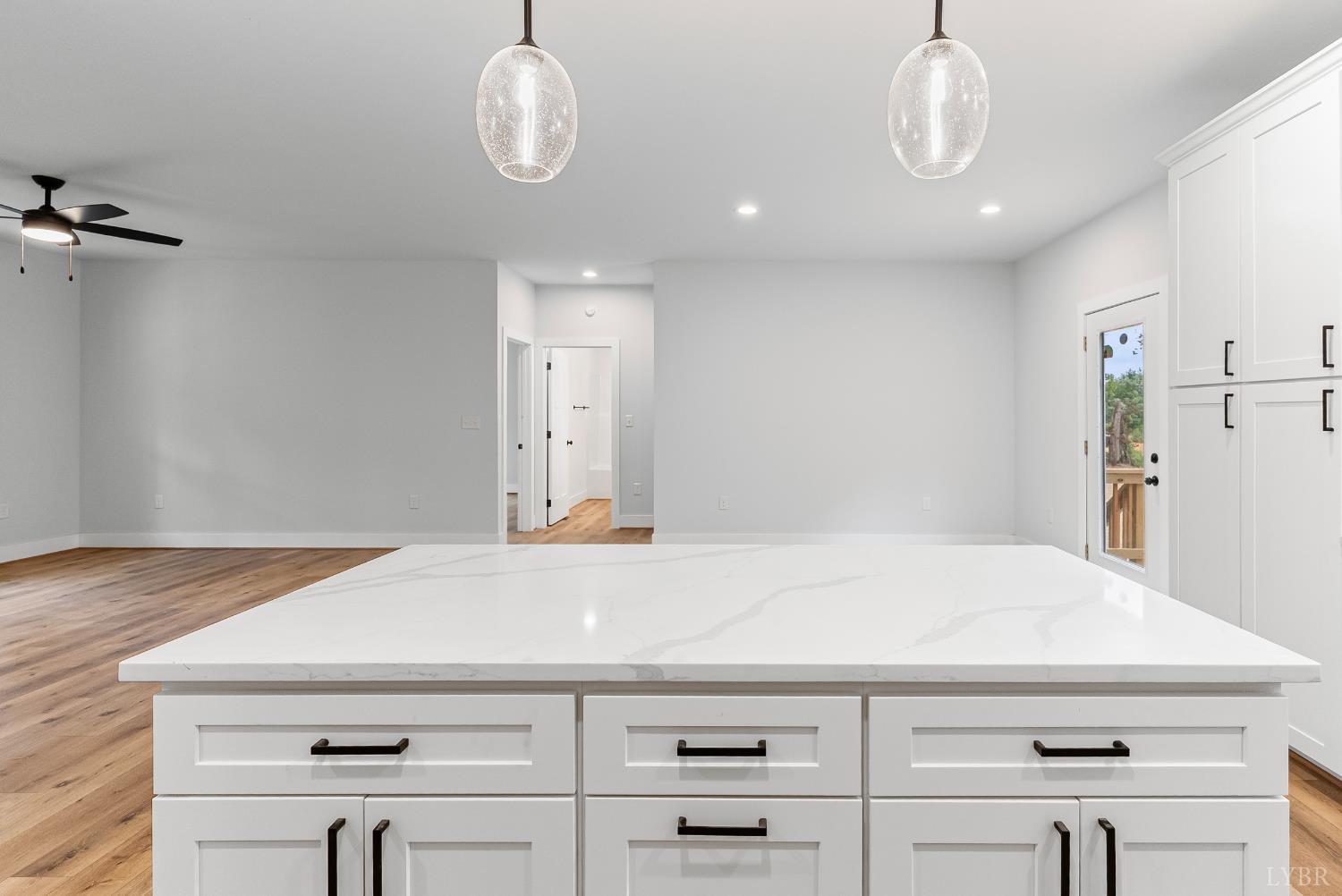 594 Community Road Dillwyn, VA 23936 - Photo 24 of 49 a kitchen with a white cabinets and wooden floor