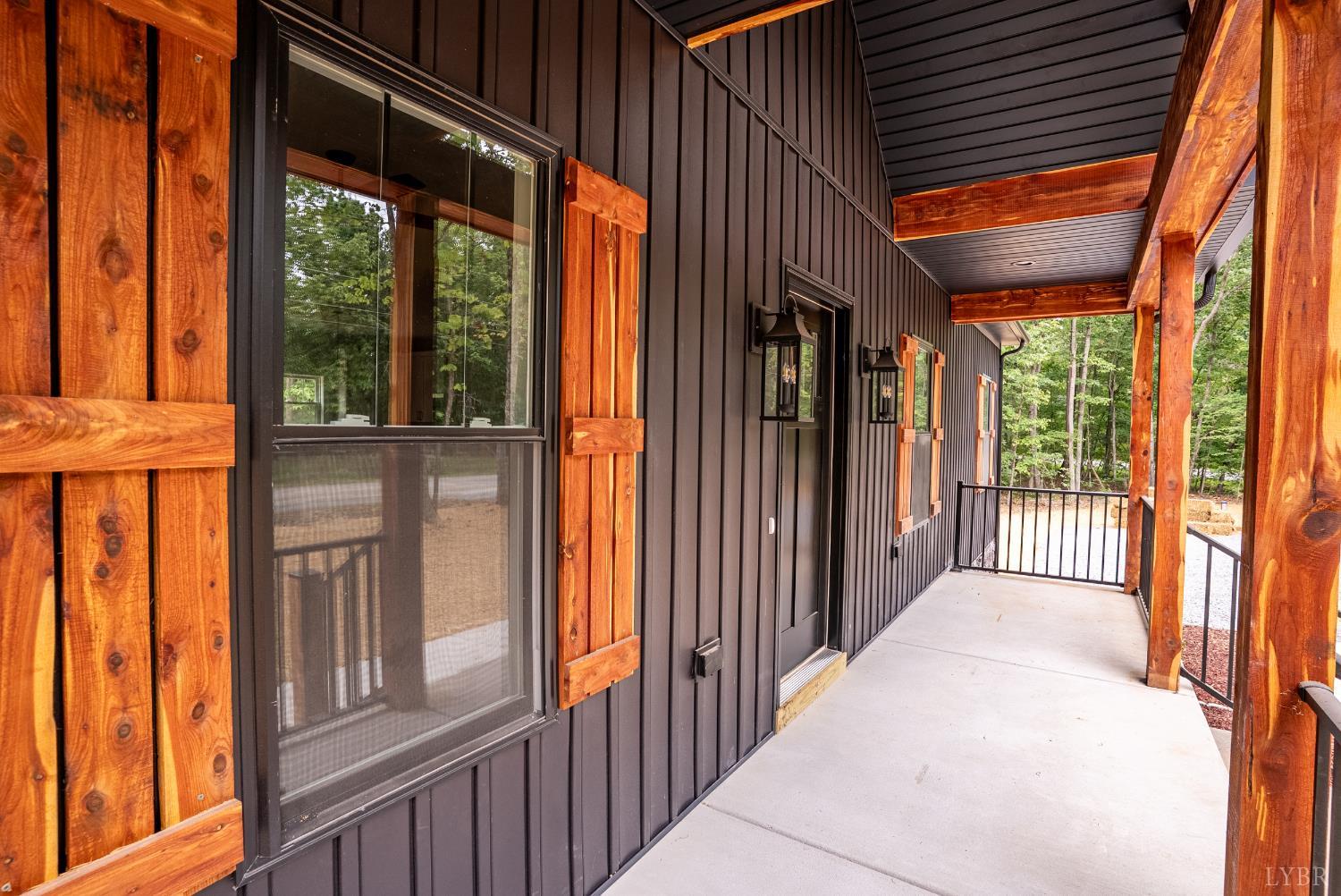 594 Community Road Dillwyn, VA 23936 - Photo 3 of 49 a view of a porch with wooden floor and floor to ceiling window