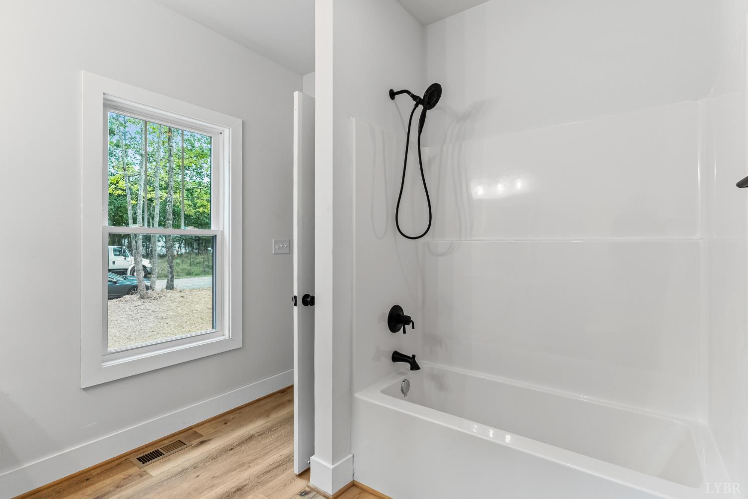 594 Community Road Dillwyn, VA 23936 - Photo 34 of 49 a bathroom with a bath tub and a shower