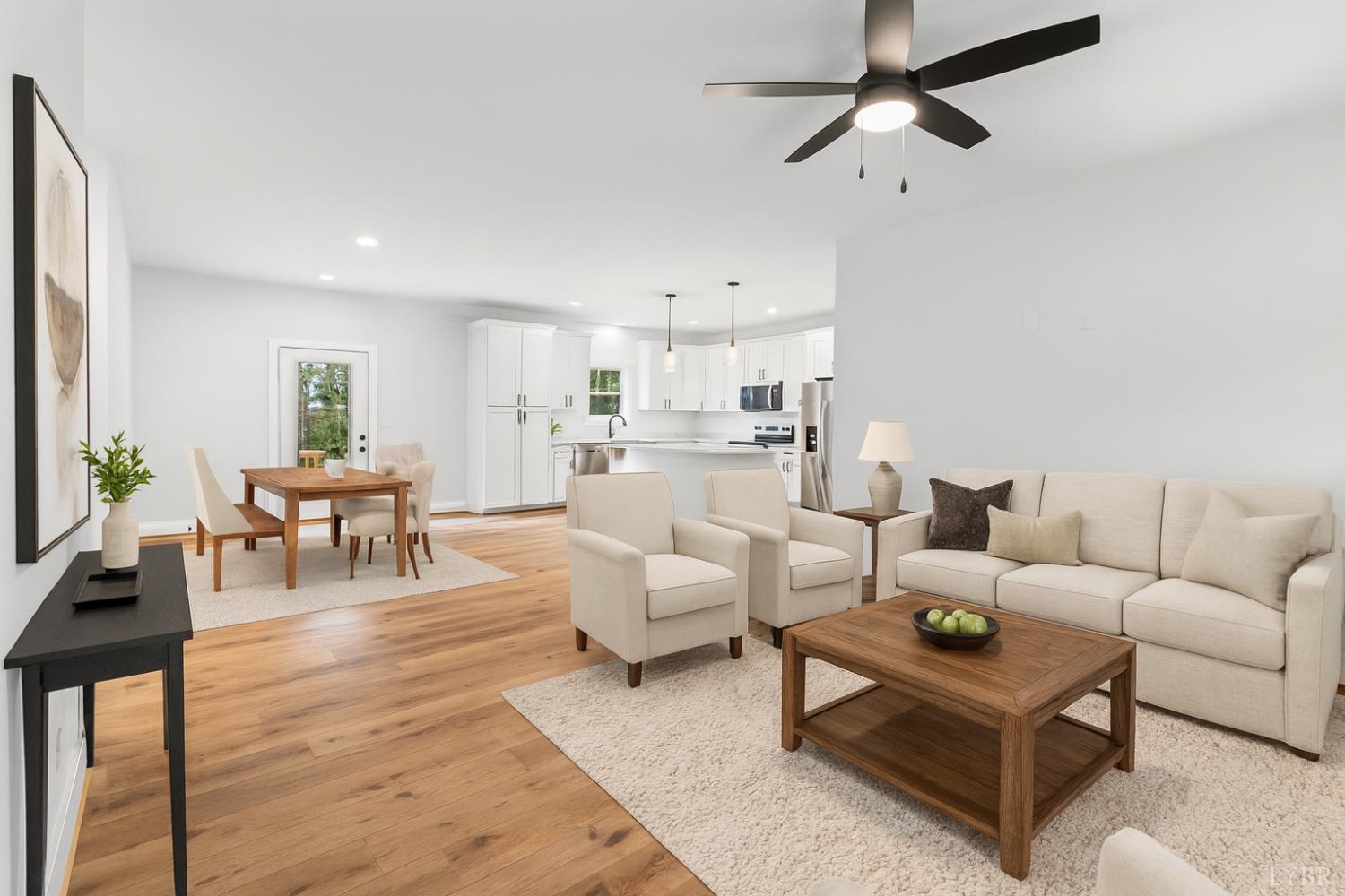 594 Community Road Dillwyn, VA 23936 - Photo 4 of 49 a living room with furniture and a dining table with wooden floor