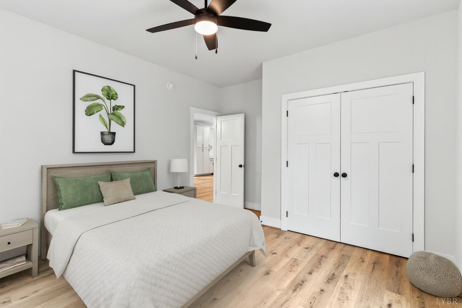 594 Community Road Dillwyn, VA 23936 - Photo 7 of 49 a bedroom with a large bed and a chandelier