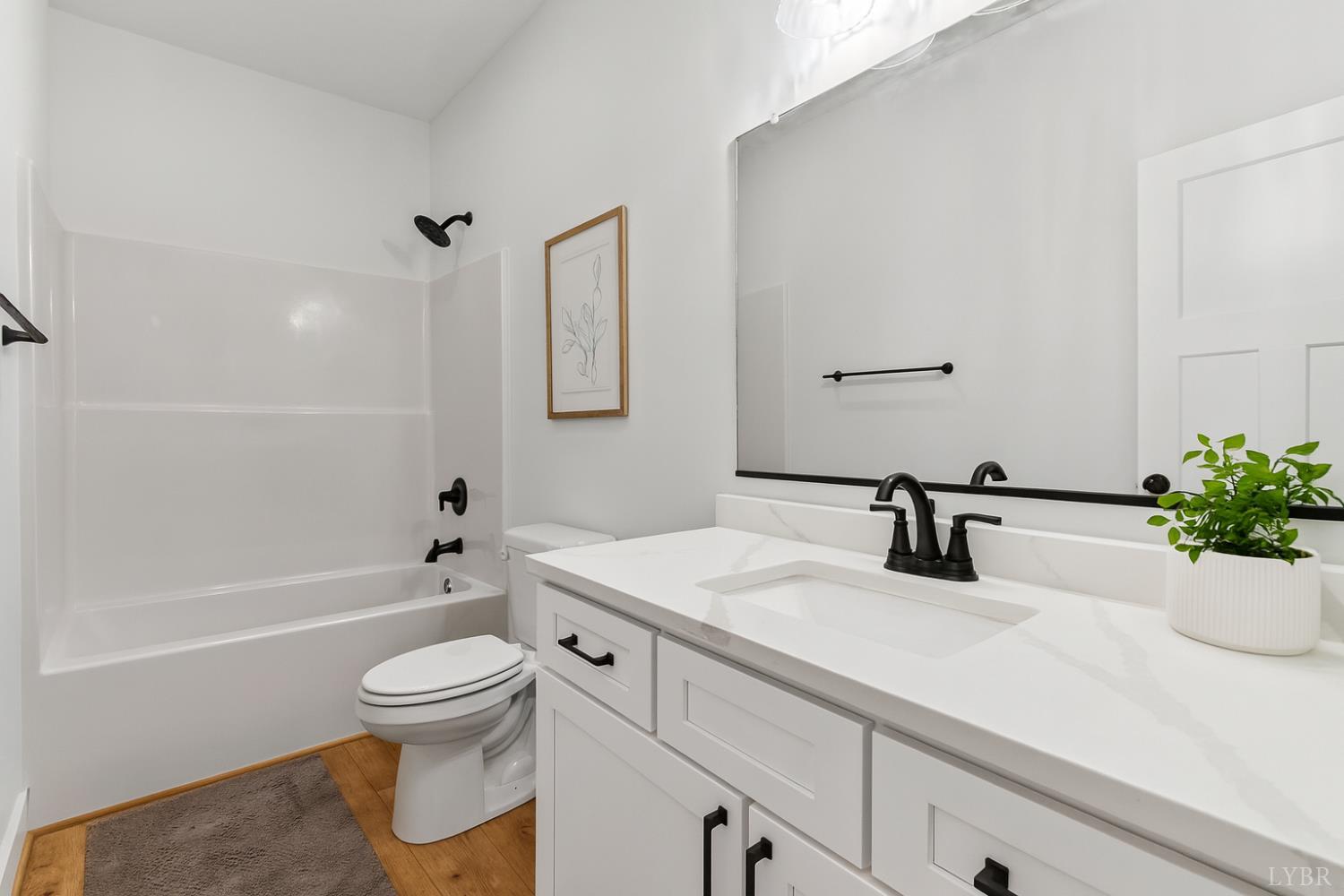 594 Community Road Dillwyn, VA 23936 - Photo 9 of 49 a bathroom with a sink a toilet and a bathtub