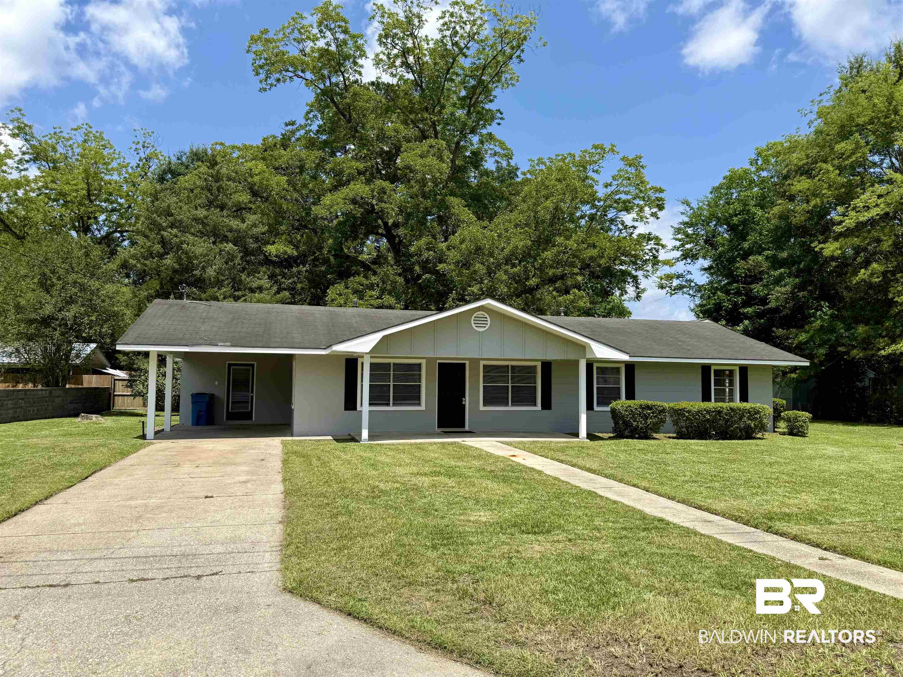 103 Kimberly Street Brewton, AL 36426 - Photo 1 of 18 Ranch-style home featuring driveway and an attached carport
