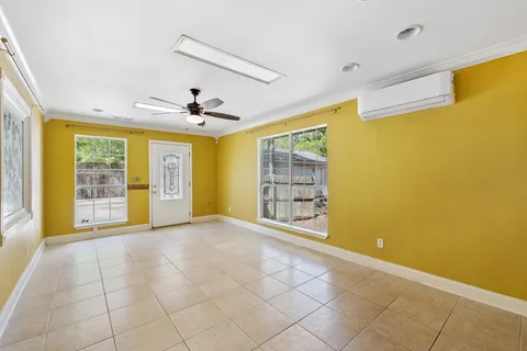 a view of an empty room with a window