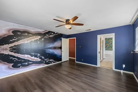 a view of a livingroom with wooden floor