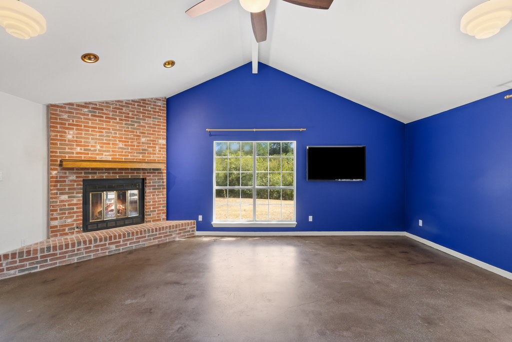 2412 Jones Road Austin, TX 78745 - Photo 23 of 40 a view of a livingroom with wooden floor and a large window