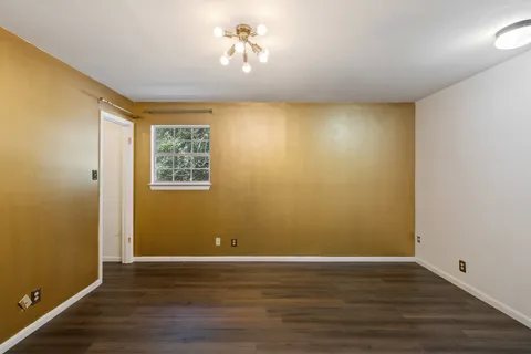 a view of room with wooden floor