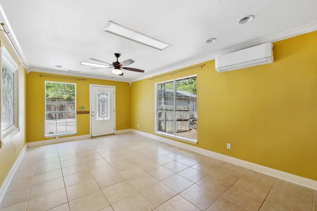 a view of an empty room with a window