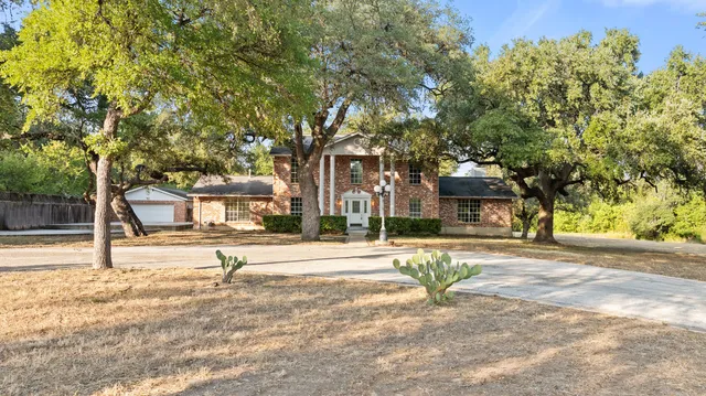 a house with trees in front of it