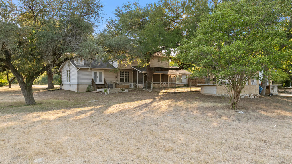 2412 Jones Road Austin, TX 78745 - Photo 32 of 40 a front view of a house with a yard