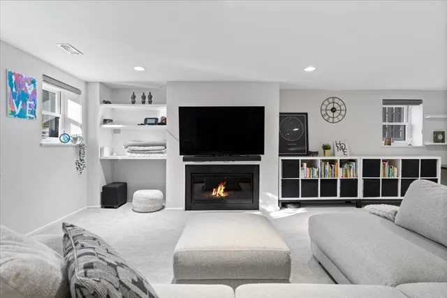 a bedroom with a bed and a television