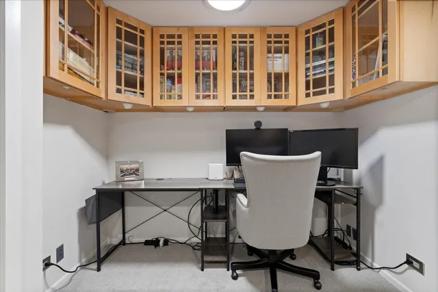 a view of a room with a table and chairs