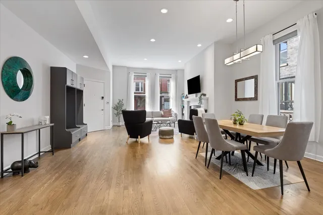 a view of a dining room with furniture and wooden floor