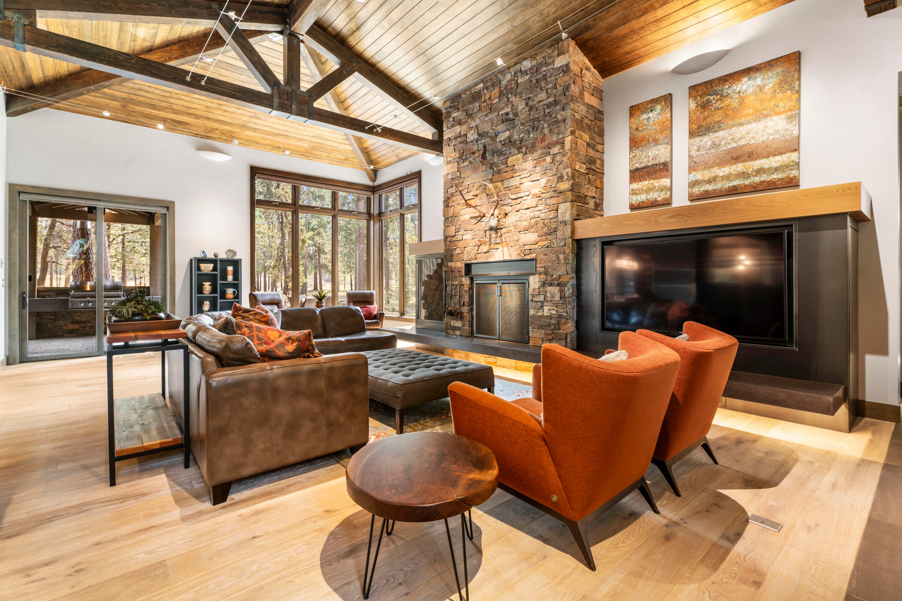 56641 Sunstone Loop, Unit 135 Bend, OR 97707 - Photo 2 of 62 The expansive great room showcases a vaulted wood ceiling & full masonry wood-burning fireplace w/ convenient exterior wood box access.