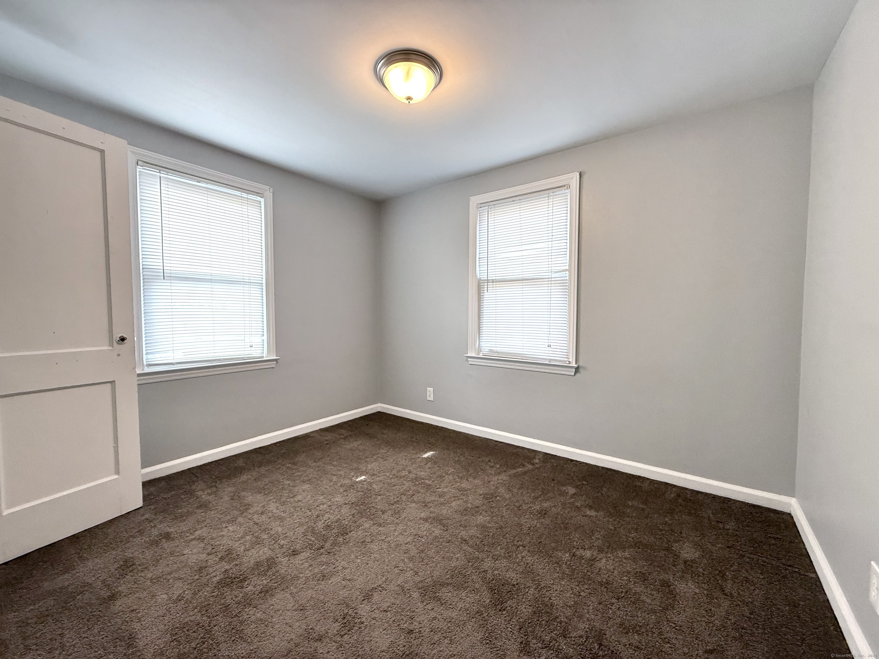 211 Spencer Street Naugatuck, CT 06770 - Photo 13 of 25 an empty room with a window