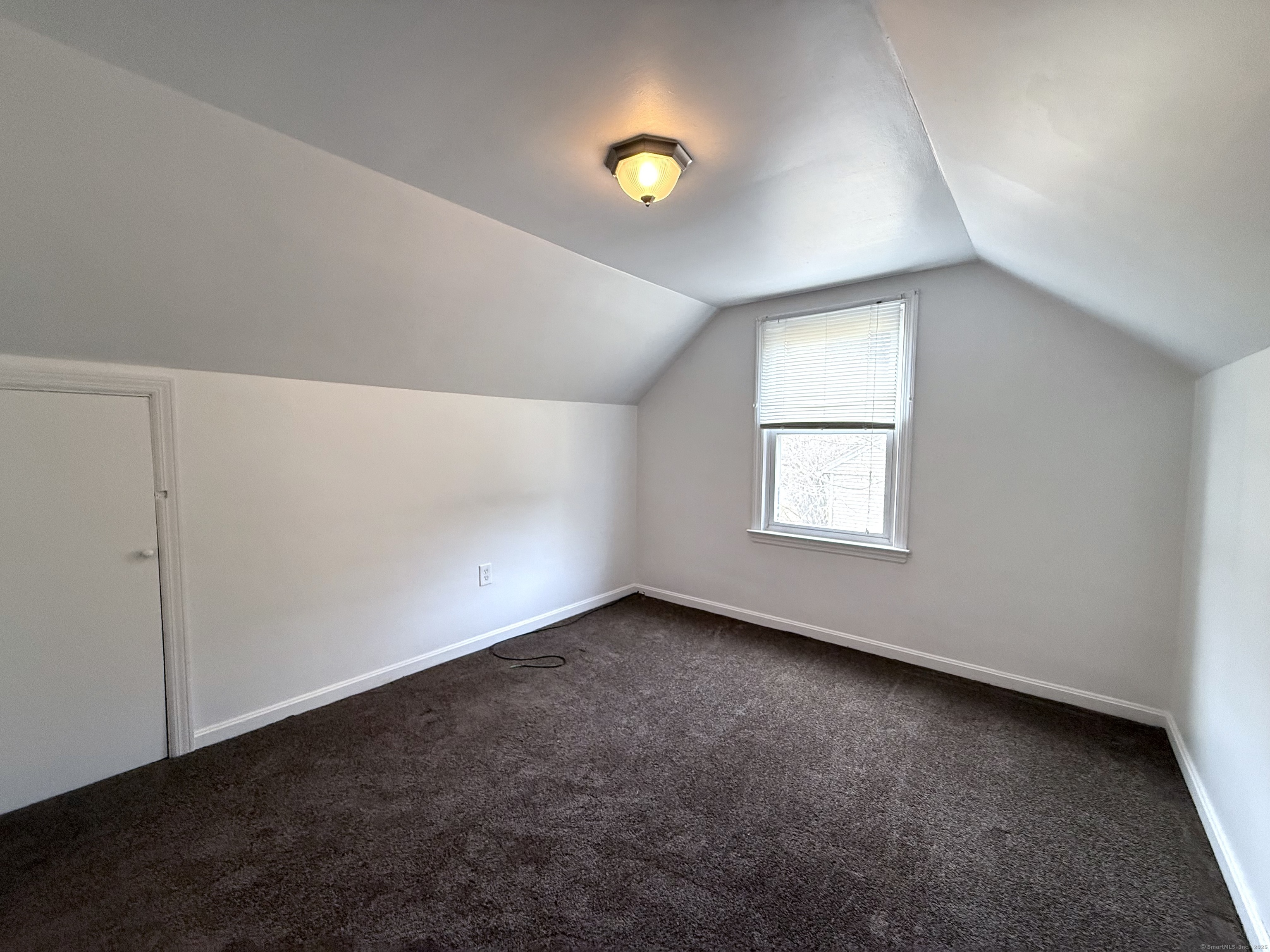 211 Spencer Street Naugatuck, CT 06770 - Photo 17 of 25 an empty room with a window and a ceiling fan