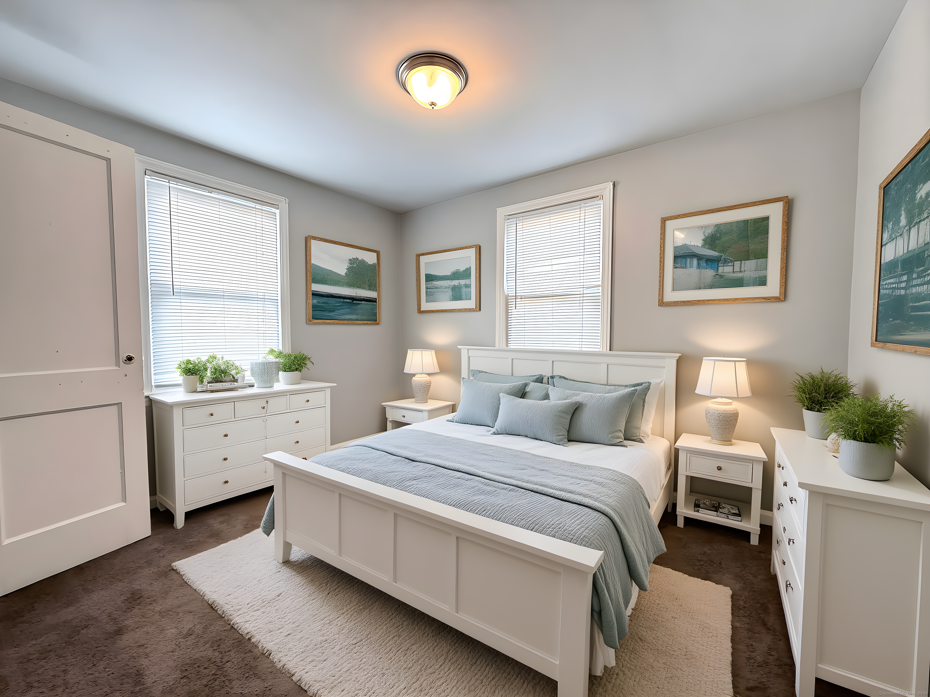 211 Spencer Street Naugatuck, CT 06770 - Photo 4 of 25 a room with a bed and a potted plant