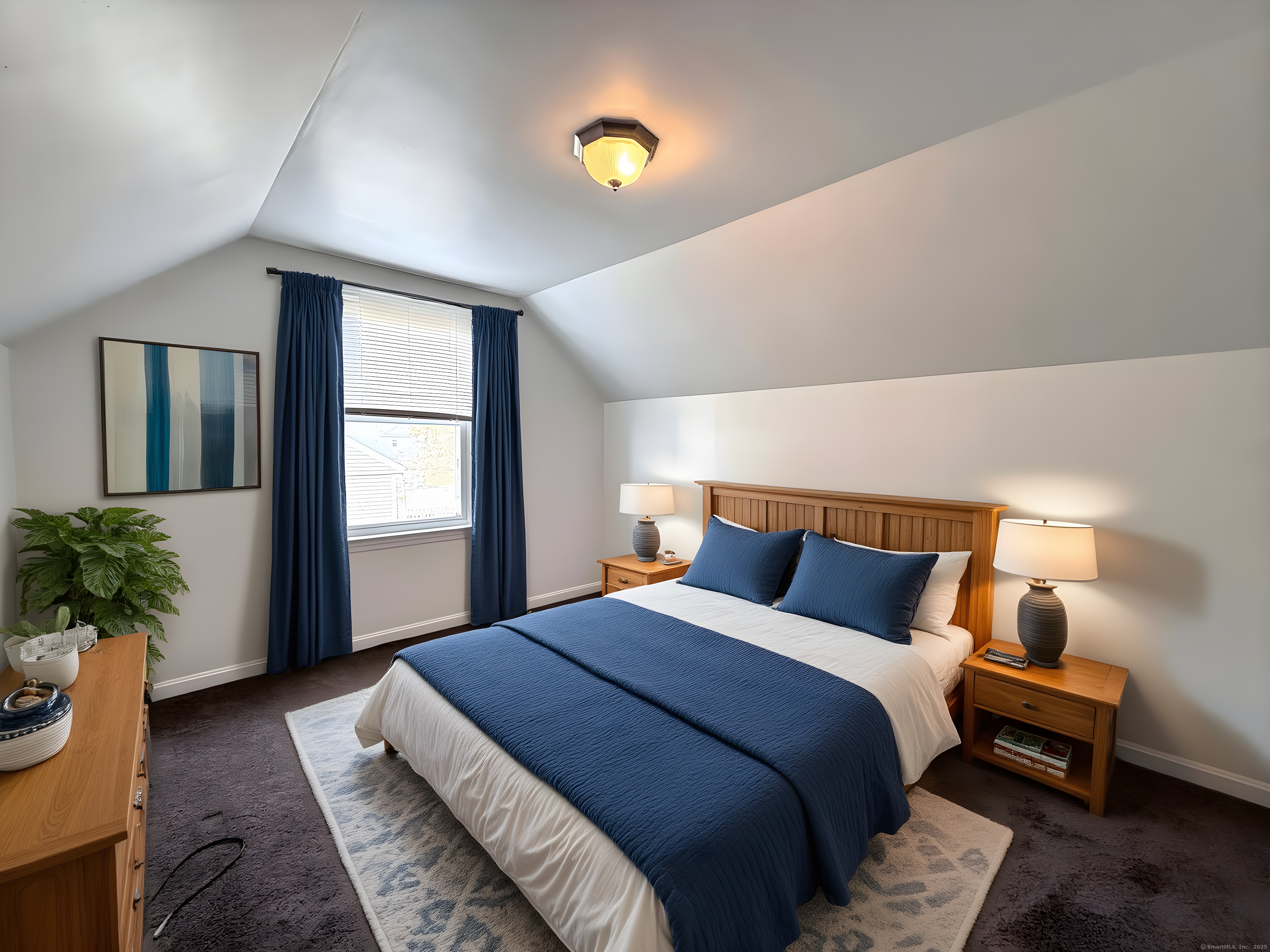 211 Spencer Street Naugatuck, CT 06770 - Photo 5 of 25 a bedroom with bed and a potted plant